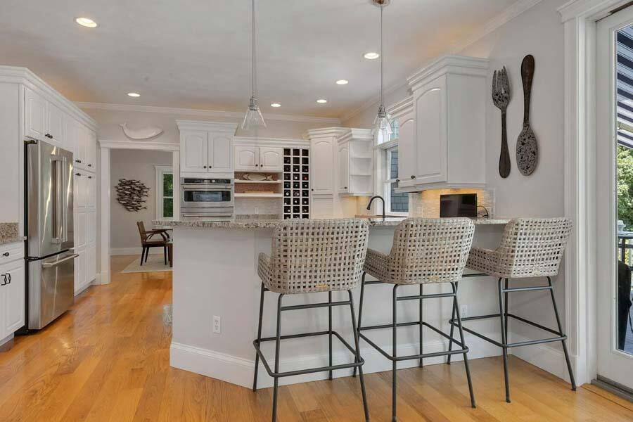 848 Cedar Street West Barnstable, MA 02668 - Photo 11 of 51 a kitchen with stainless steel appliances kitchen island granite countertop a refrigerator and microwave