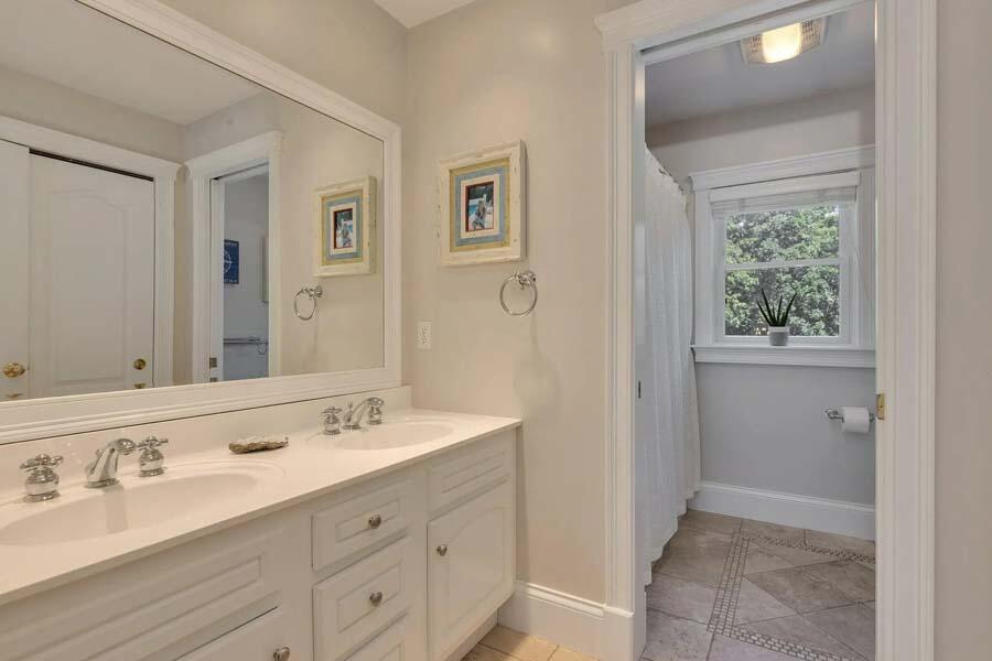 848 Cedar Street West Barnstable, MA 02668 - Photo 28 of 51 a bathroom with a double vanity sink and a mirror