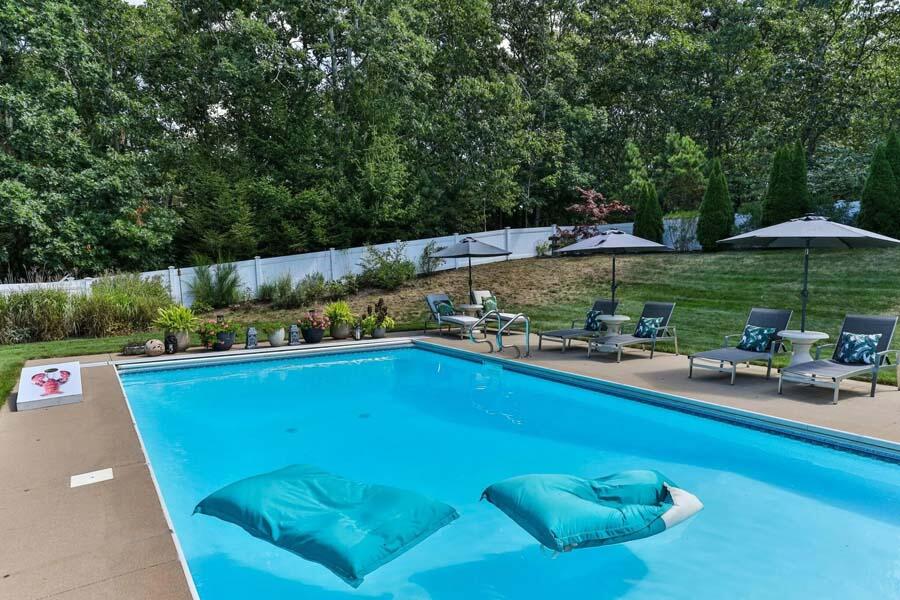 848 Cedar Street West Barnstable, MA 02668 - Photo 42 of 51 a view of a swimming pool and lounge chairs