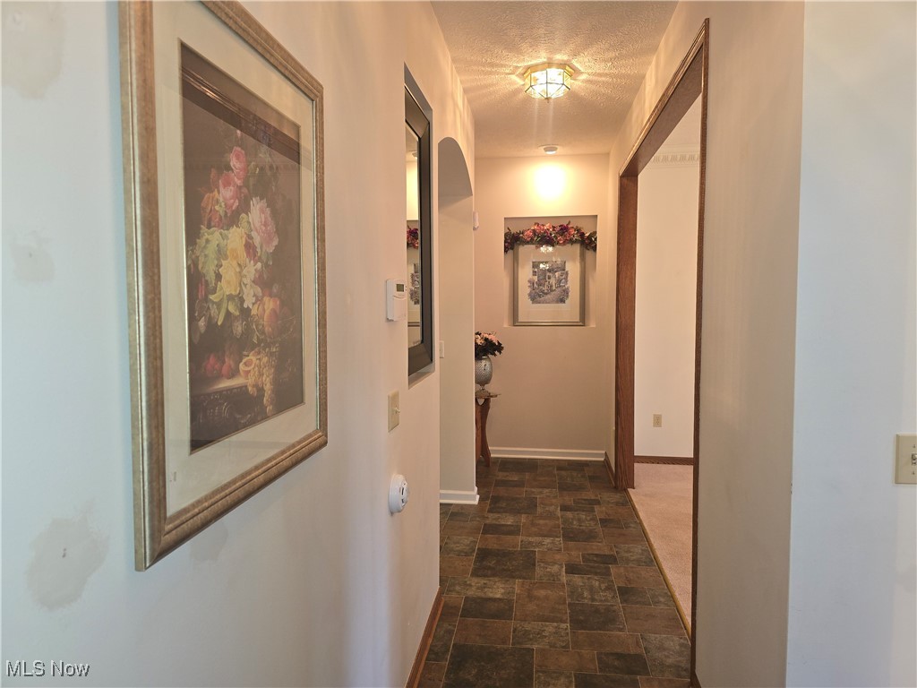 1272 Portage Line Road Akron, OH 44312 - Photo 8 of 38 Hallway from entry leading to great room.