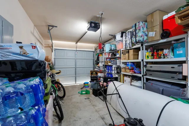 a view of gym equipment with clothes and shoes