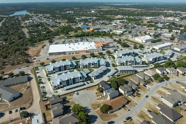 a view of house with yard and outdoor seating