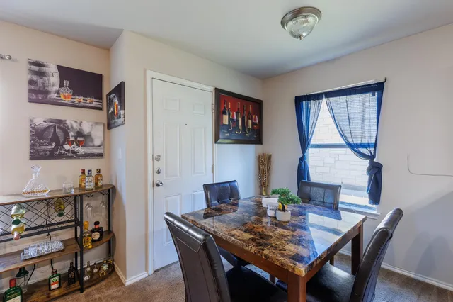 a view of a dining room with furniture