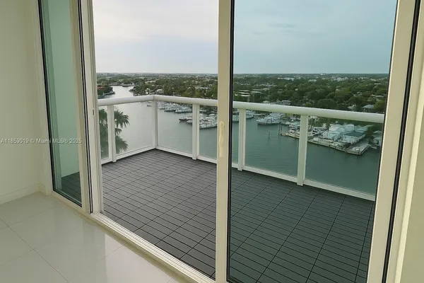a view of a balcony with wooden floor