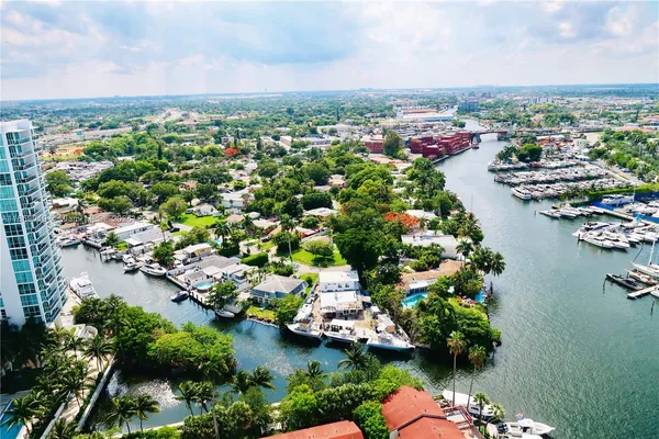 an aerial view of a houses with a lake view