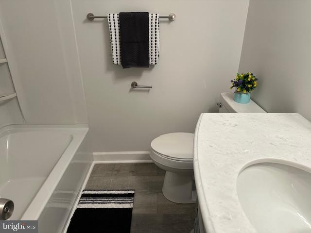 26022 Zion Road Ruther Glen, VA 22546 - Photo 11 of 21 a bathroom with a toilet and a sink