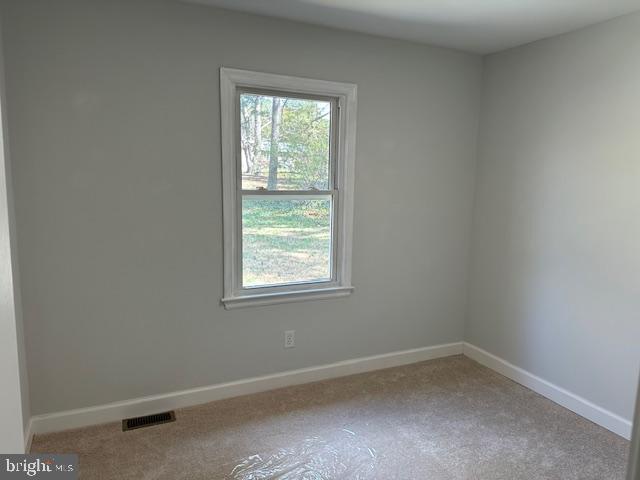 26022 Zion Road Ruther Glen, VA 22546 - Photo 14 of 21 an empty room with a window