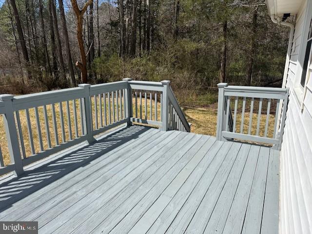 26022 Zion Road Ruther Glen, VA 22546 - Photo 19 of 21 a balcony with wooden floor and yard in the back