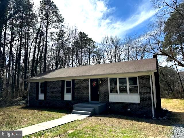 26022 Zion Road Ruther Glen, VA 22546 - Photo 2 of 21 a front view of a house with a yard