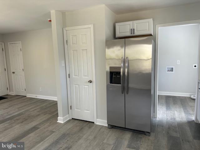 26022 Zion Road Ruther Glen, VA 22546 - Photo 7 of 21 a kitchen with wooden floor and refrigerator