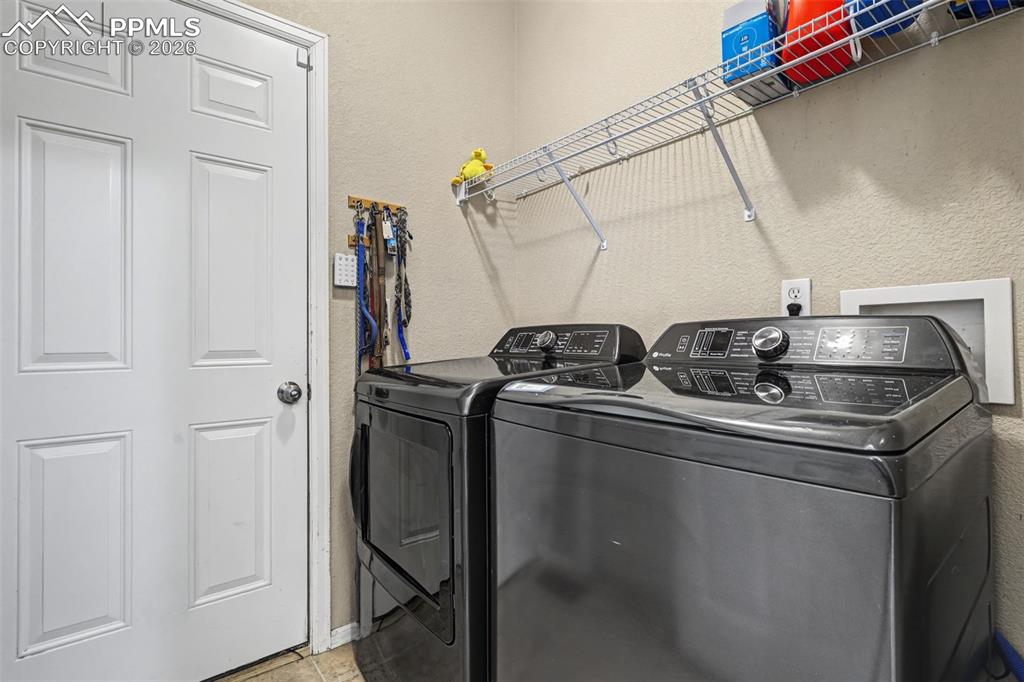 7858 Chasewood Loop Colorado Springs, CO 80908 - Photo 13 of 40 a kitchen with a sink and cabinets