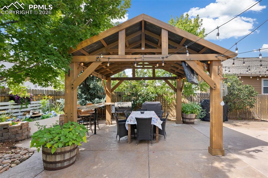 7858 Chasewood Loop Colorado Springs, CO 80908 - Photo 35 of 40 a front view of a house with garden