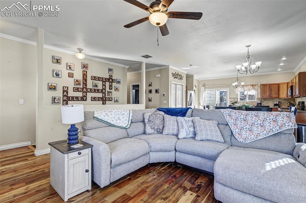 7858 Chasewood Loop Colorado Springs, CO 80908 - Photo 8 of 40 a living room with furniture and kitchen view