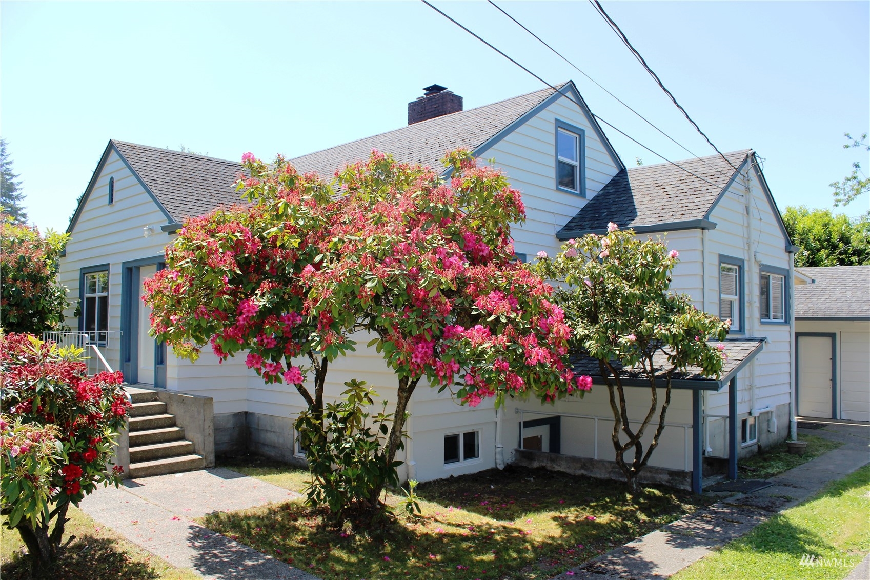 7426 Lower Ridge Road Everett, WA 98203 - Photo 1 of 28 a front view of a house with a yard