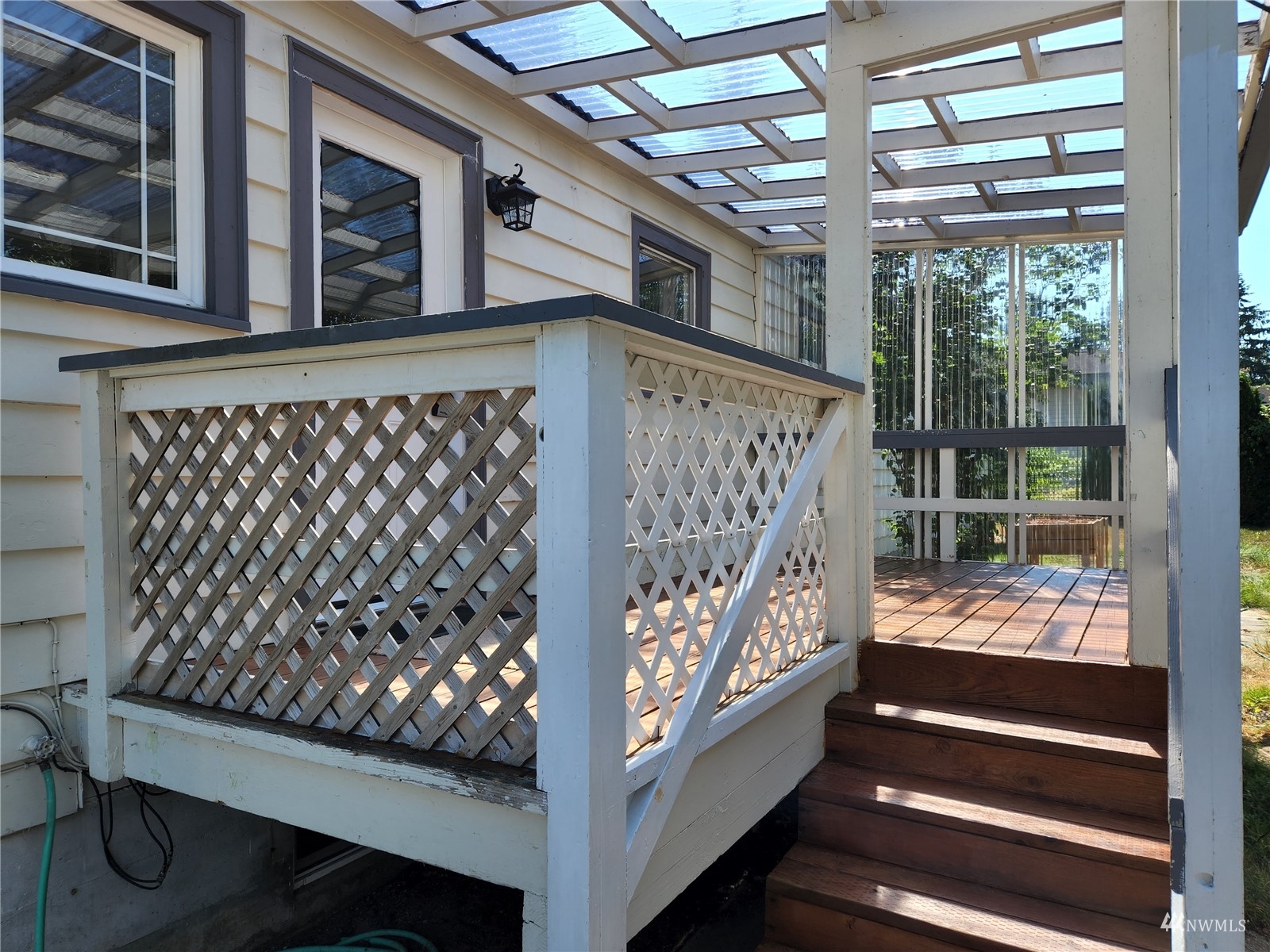 7426 Lower Ridge Road Everett, WA 98203 - Photo 13 of 28 a view of outdoor space with wooden floor and iron gate