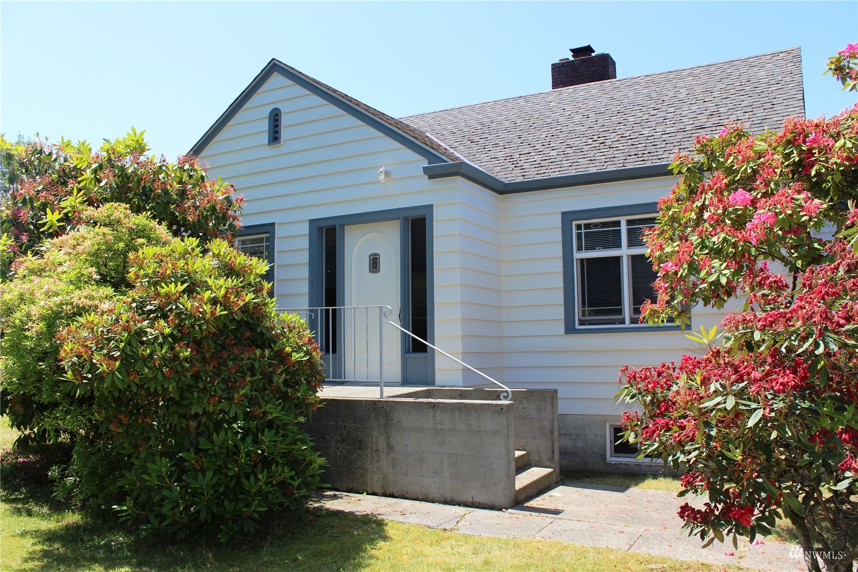 7426 Lower Ridge Road Everett, WA 98203 - Photo 2 of 28 a front view of a house with a yard