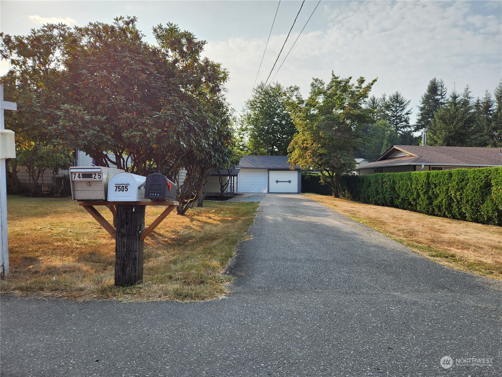 7426 Lower Ridge Road Everett, WA 98203 - Photo 27 of 28 a view of a house with backyard and trees