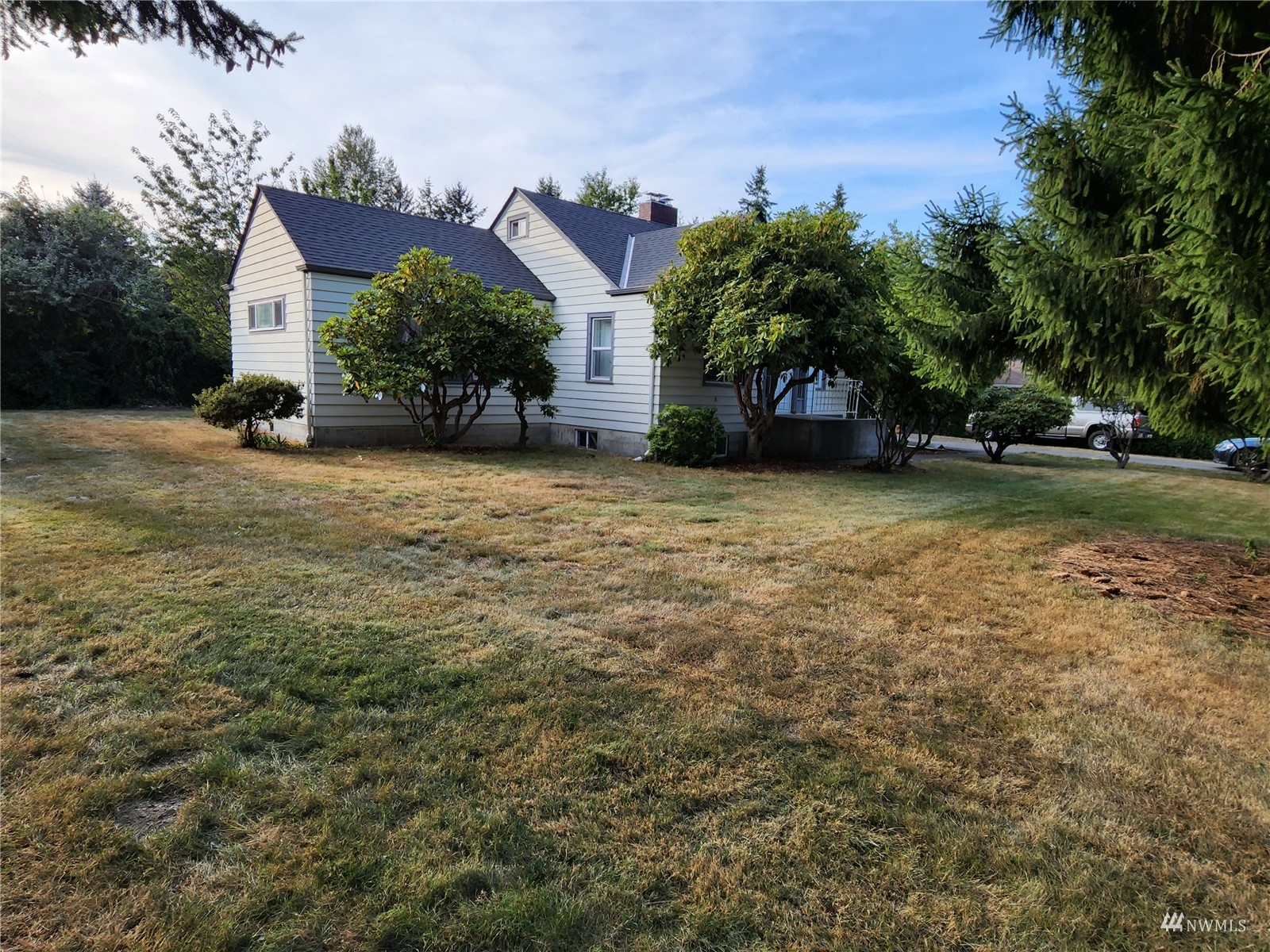 7426 Lower Ridge Road Everett, WA 98203 - Photo 3 of 28 a front view of a house with a yard and garage