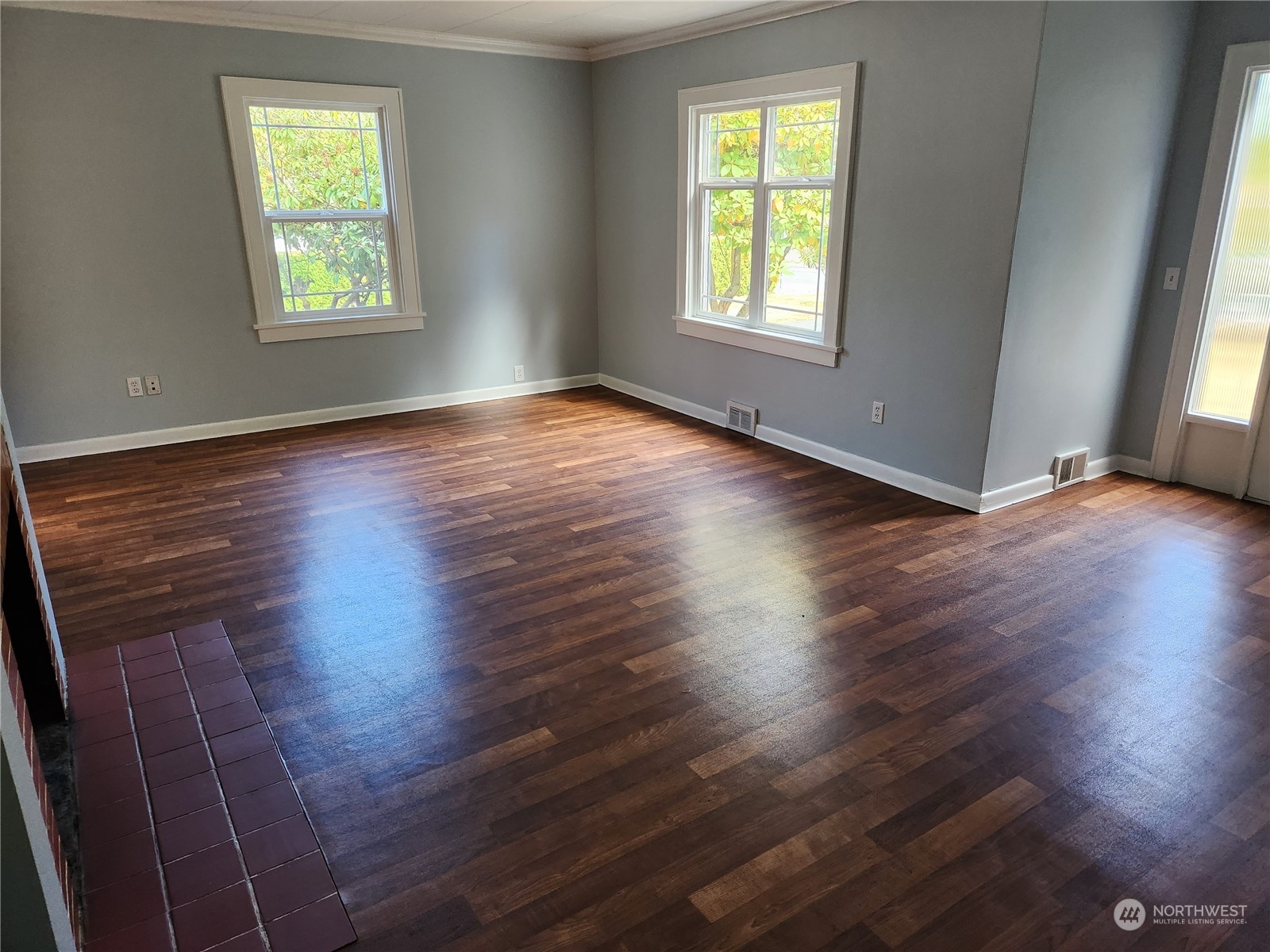 7426 Lower Ridge Road Everett, WA 98203 - Photo 5 of 28 an empty room with wooden floor and windows