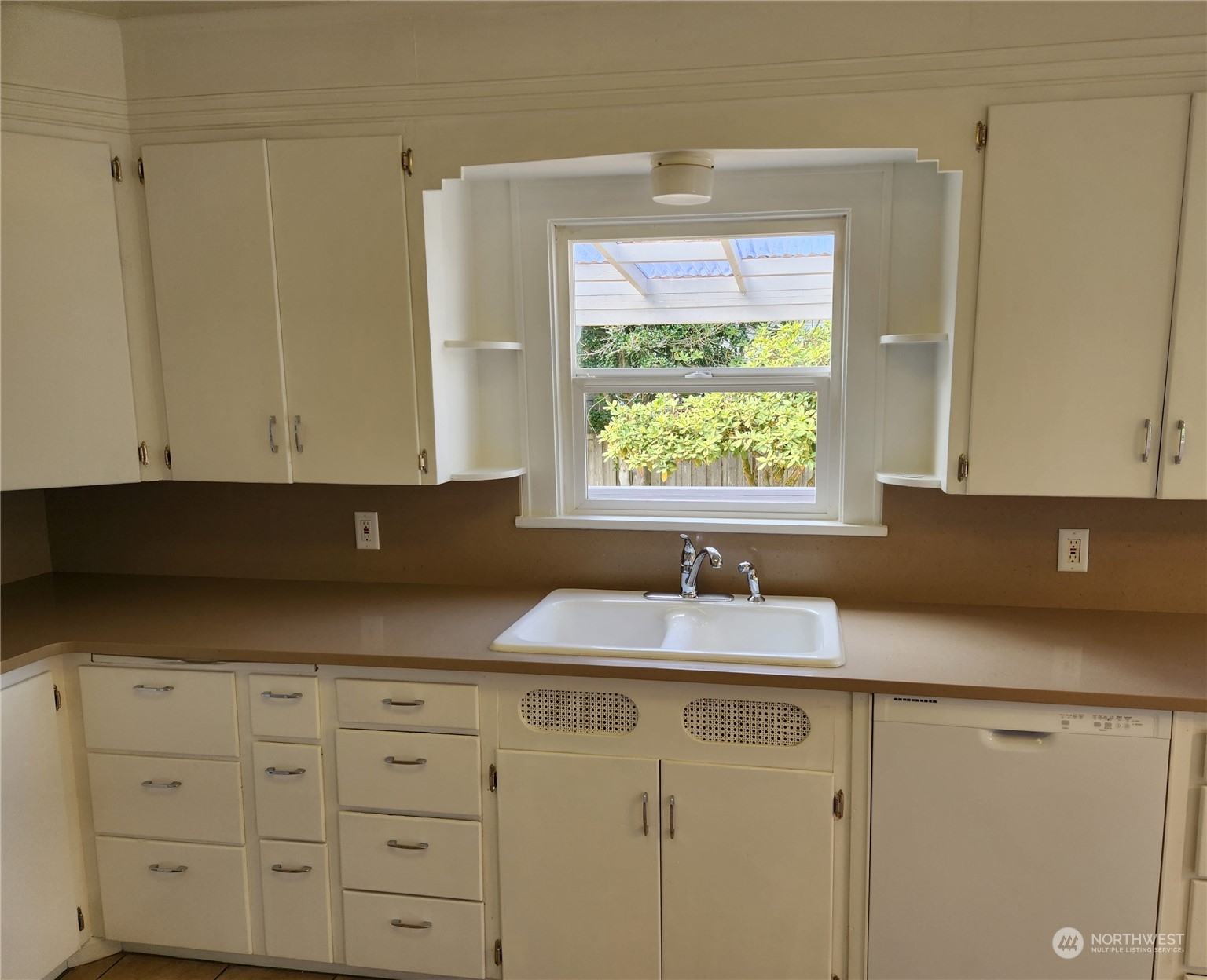 7426 Lower Ridge Road Everett, WA 98203 - Photo 10 of 28 a kitchen with granite countertop white cabinets and sink