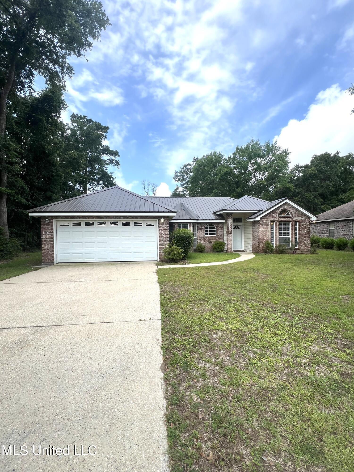 1421 Spruce Street Ocean Springs, MS 39564 - Photo 1 of 21 front