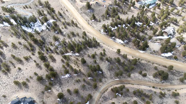 a view of a dry yard covered with snow