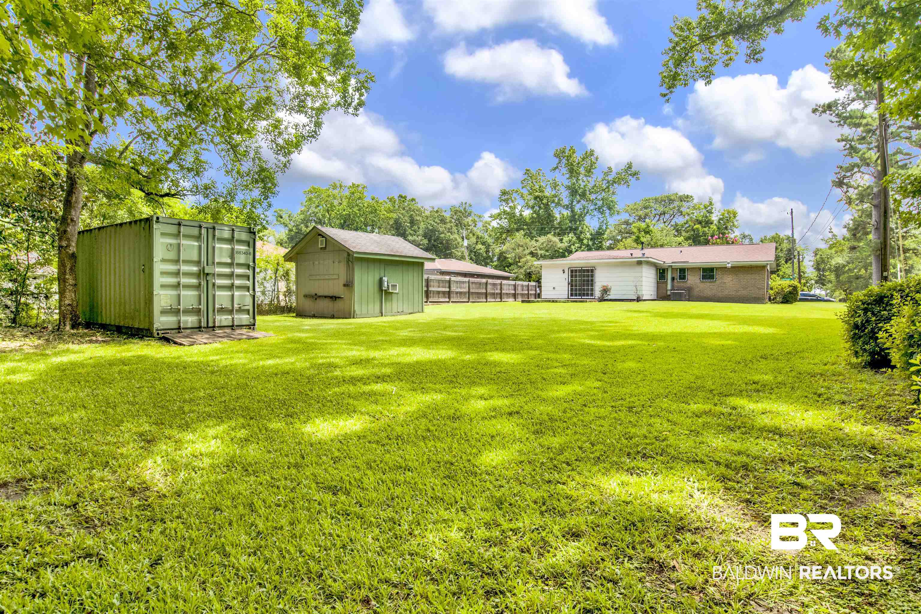 1476 Boudousquie Street Mobile, AL 36605 - Photo 30 of 34 View of yard featuring a storage shed