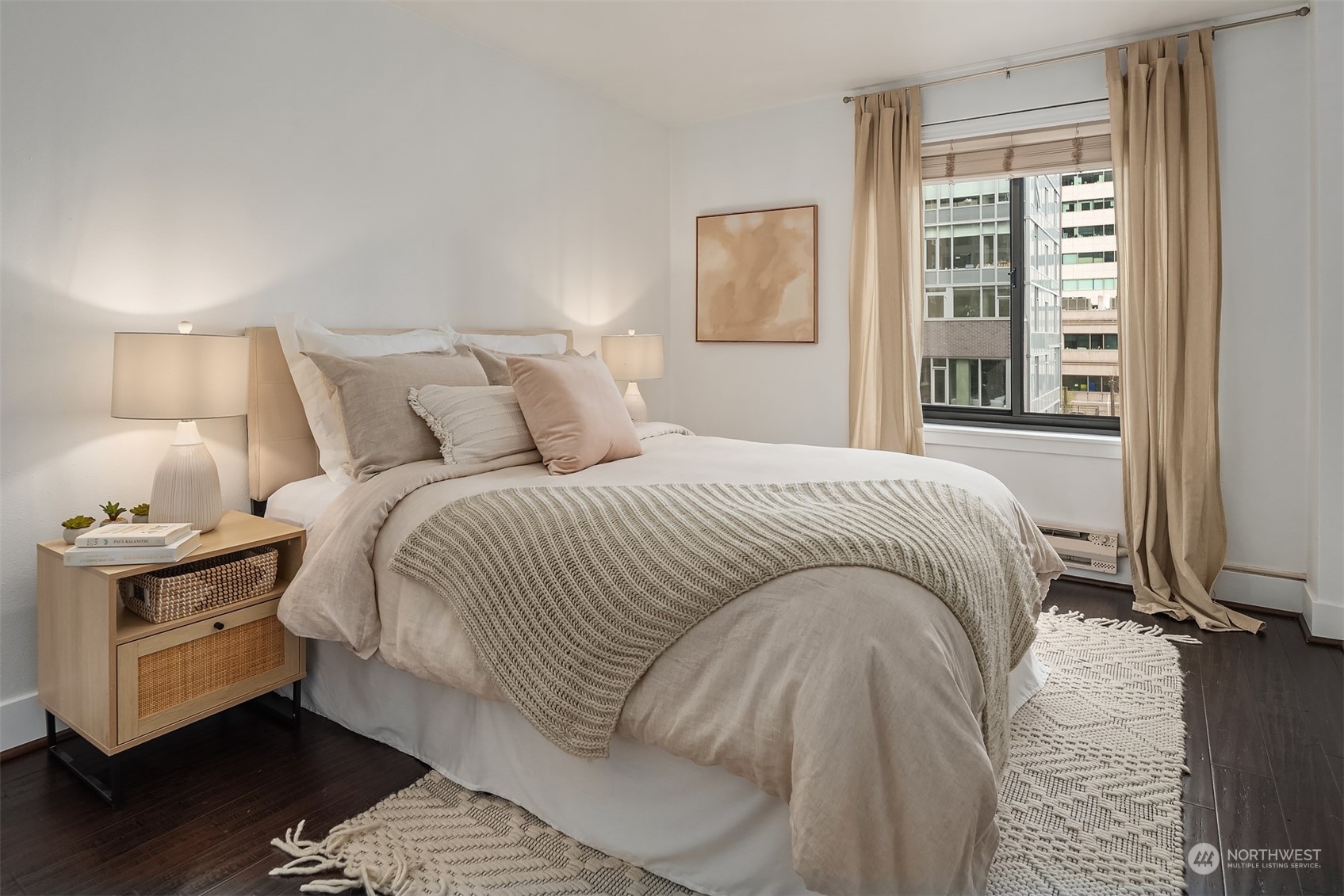 1105 Spring Street, Unit 503 Seattle, WA 98104 - Photo 10 of 18 a bedroom with a bed and wooden floor