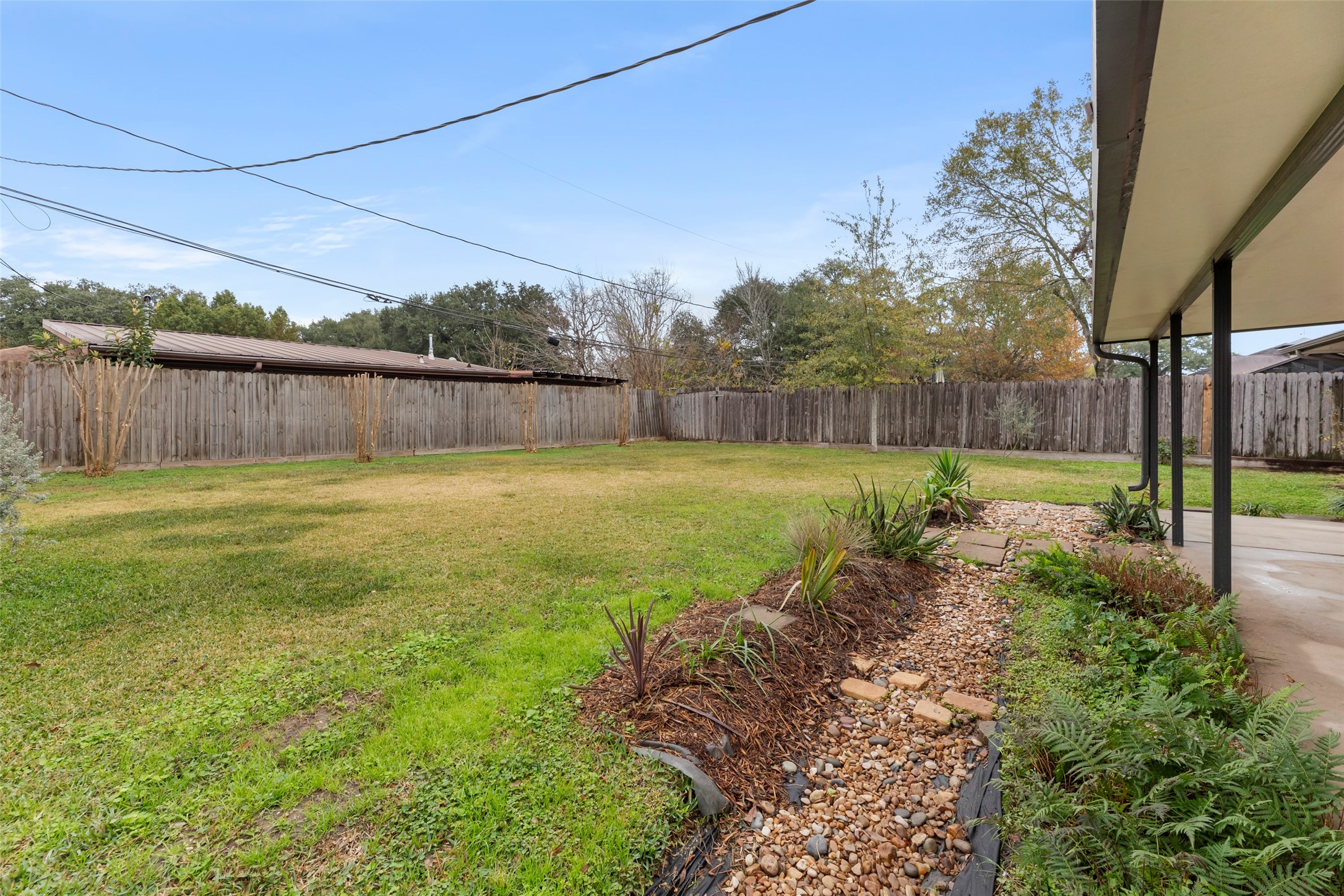 6148 Indigo Street Houston, TX 77074 - Photo 13 of 37 a view of a backyard with a large tree