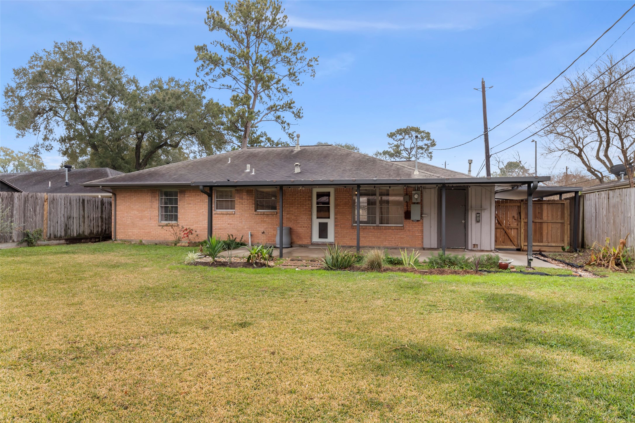 6148 Indigo Street Houston, TX 77074 - Photo 14 of 37 a front view of a house with a garden