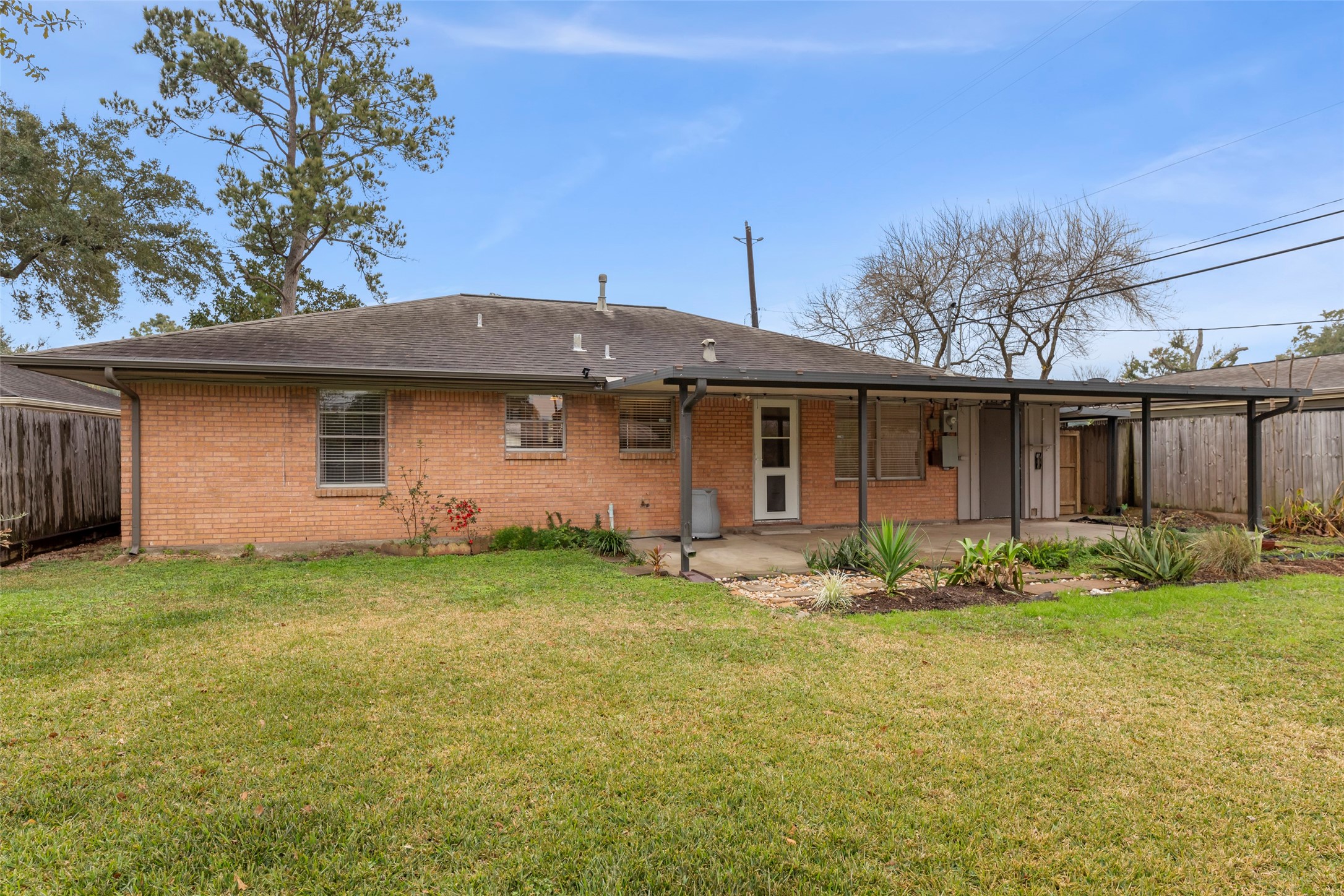 6148 Indigo Street Houston, TX 77074 - Photo 17 of 37 a front view of a house with garden