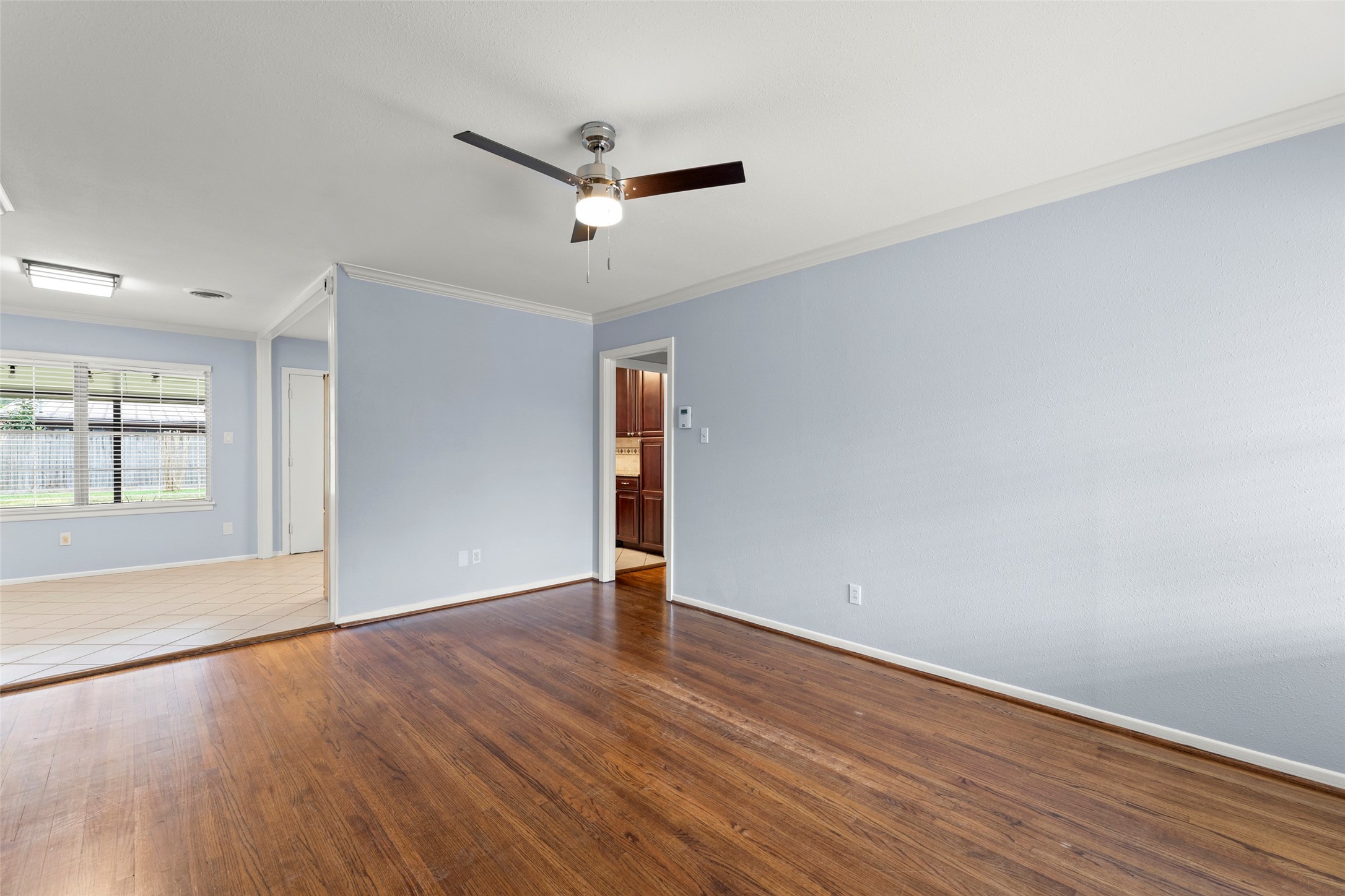 6148 Indigo Street Houston, TX 77074 - Photo 20 of 37 an empty room with wooden floor and windows