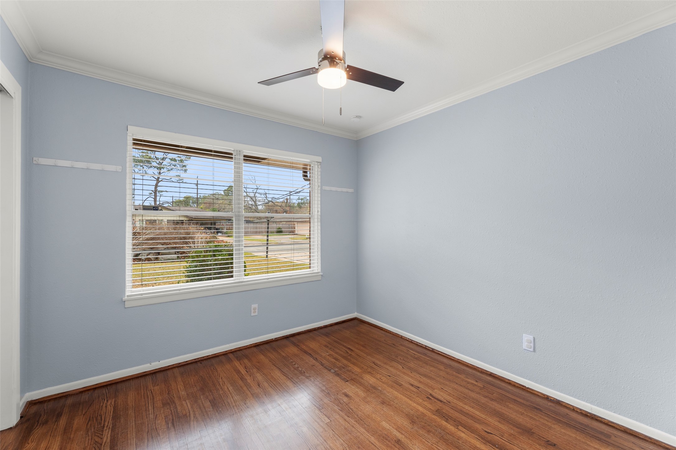 6148 Indigo Street Houston, TX 77074 - Photo 28 of 37 a view of an empty room with wooden floor and a window