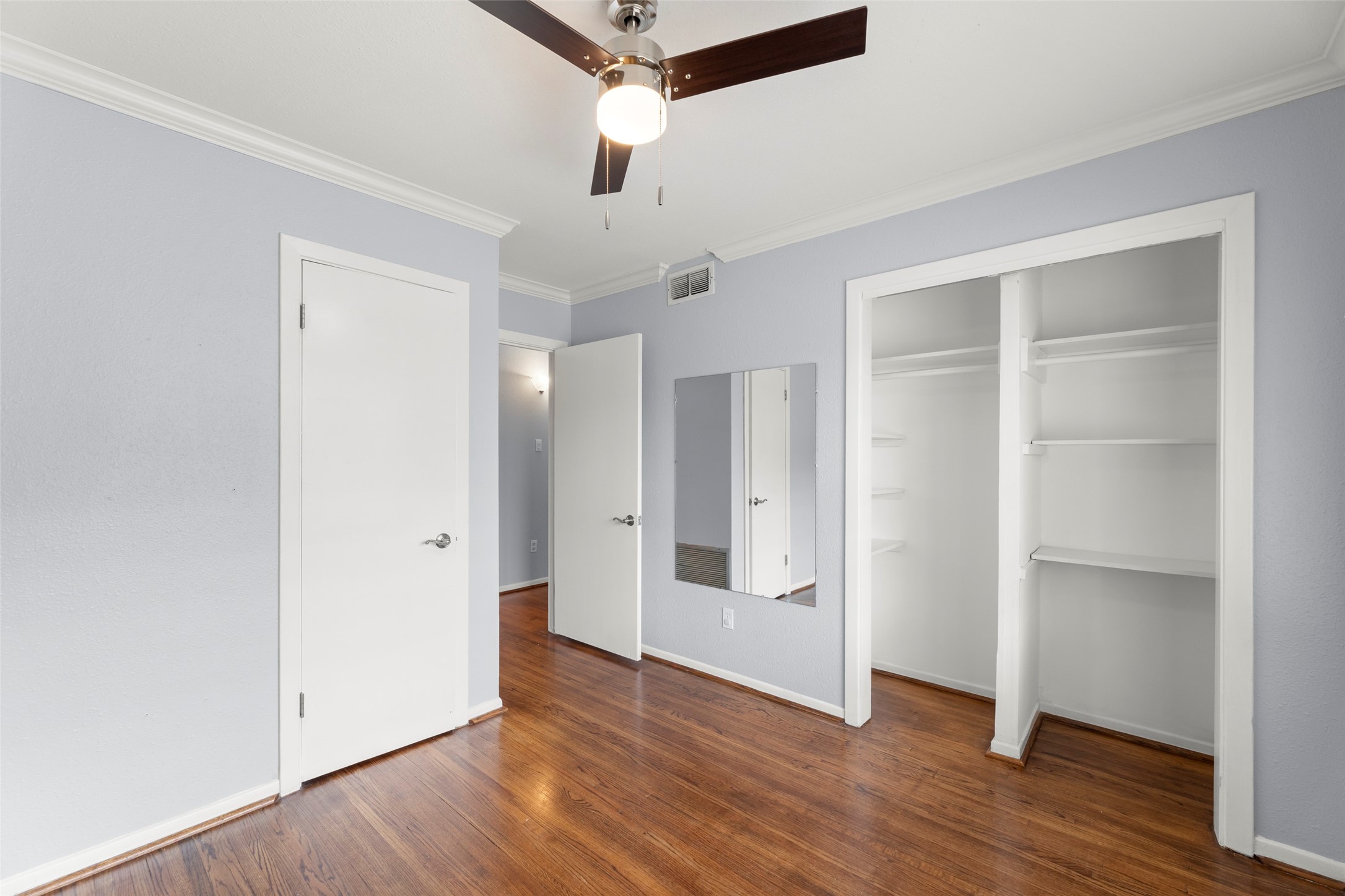 6148 Indigo Street Houston, TX 77074 - Photo 29 of 37 an empty room with wooden floor & closet and windows