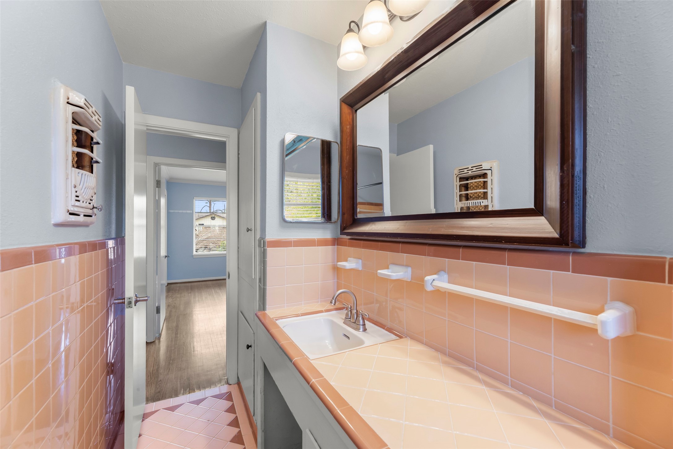 6148 Indigo Street Houston, TX 77074 - Photo 31 of 37 a bathroom with a sink a vanity and a mirror