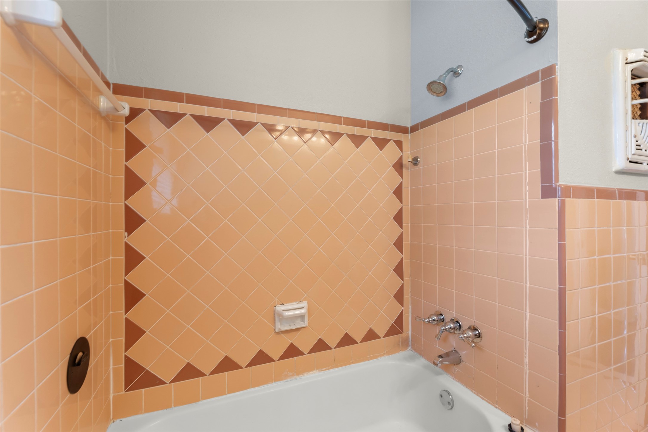 6148 Indigo Street Houston, TX 77074 - Photo 32 of 37 a bathroom with a shower and a tub