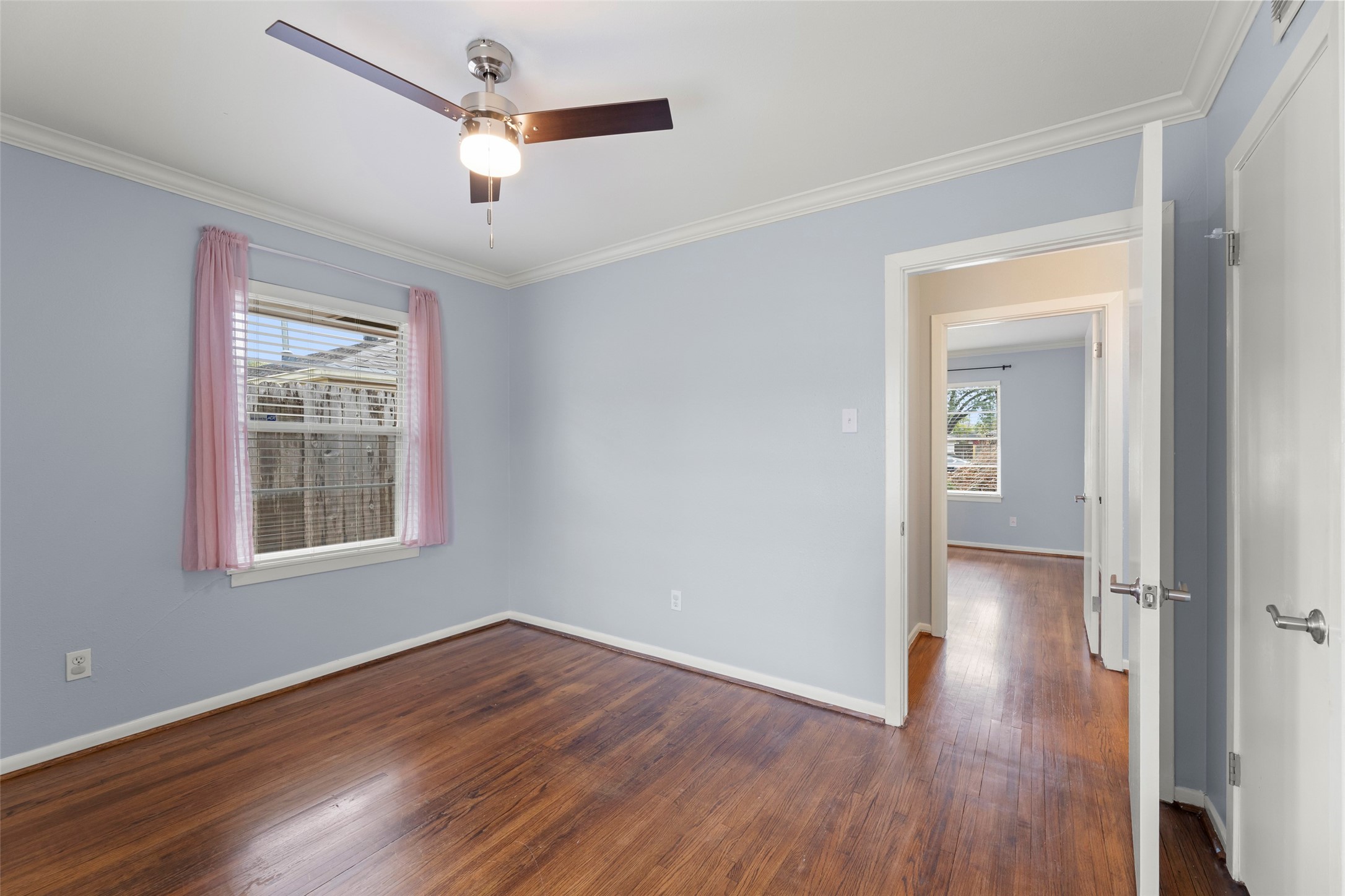 6148 Indigo Street Houston, TX 77074 - Photo 34 of 37 wooden floor in an empty room with a window