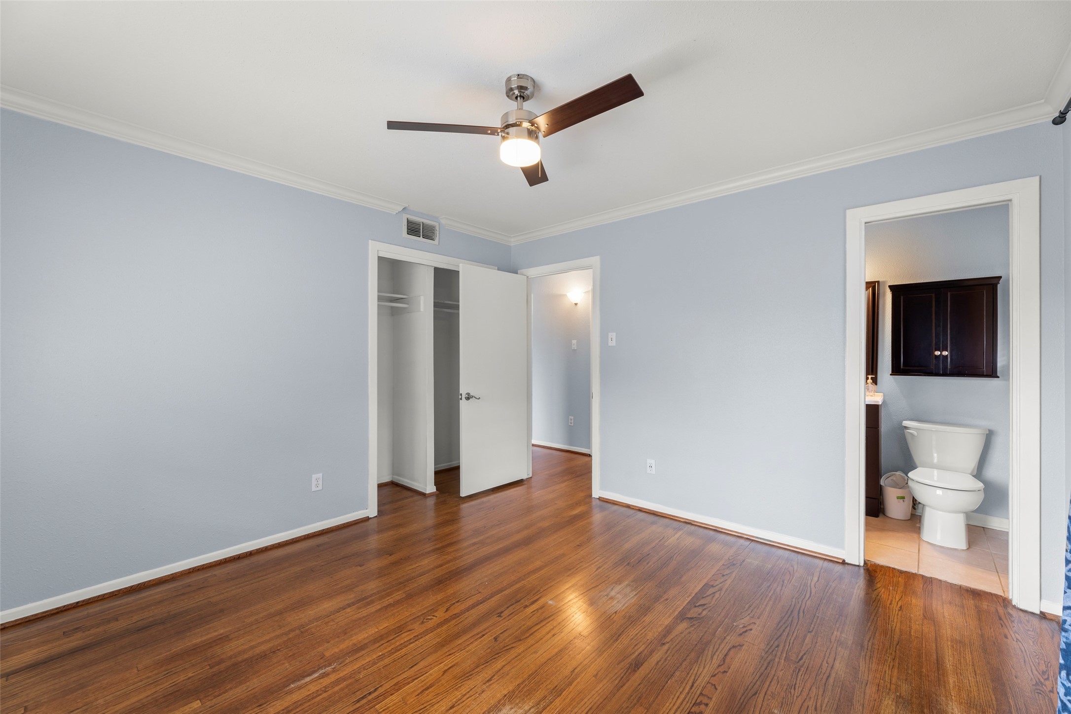 6148 Indigo Street Houston, TX 77074 - Photo 36 of 37 a view of a livingroom with a hardwood floor and a ceiling fan