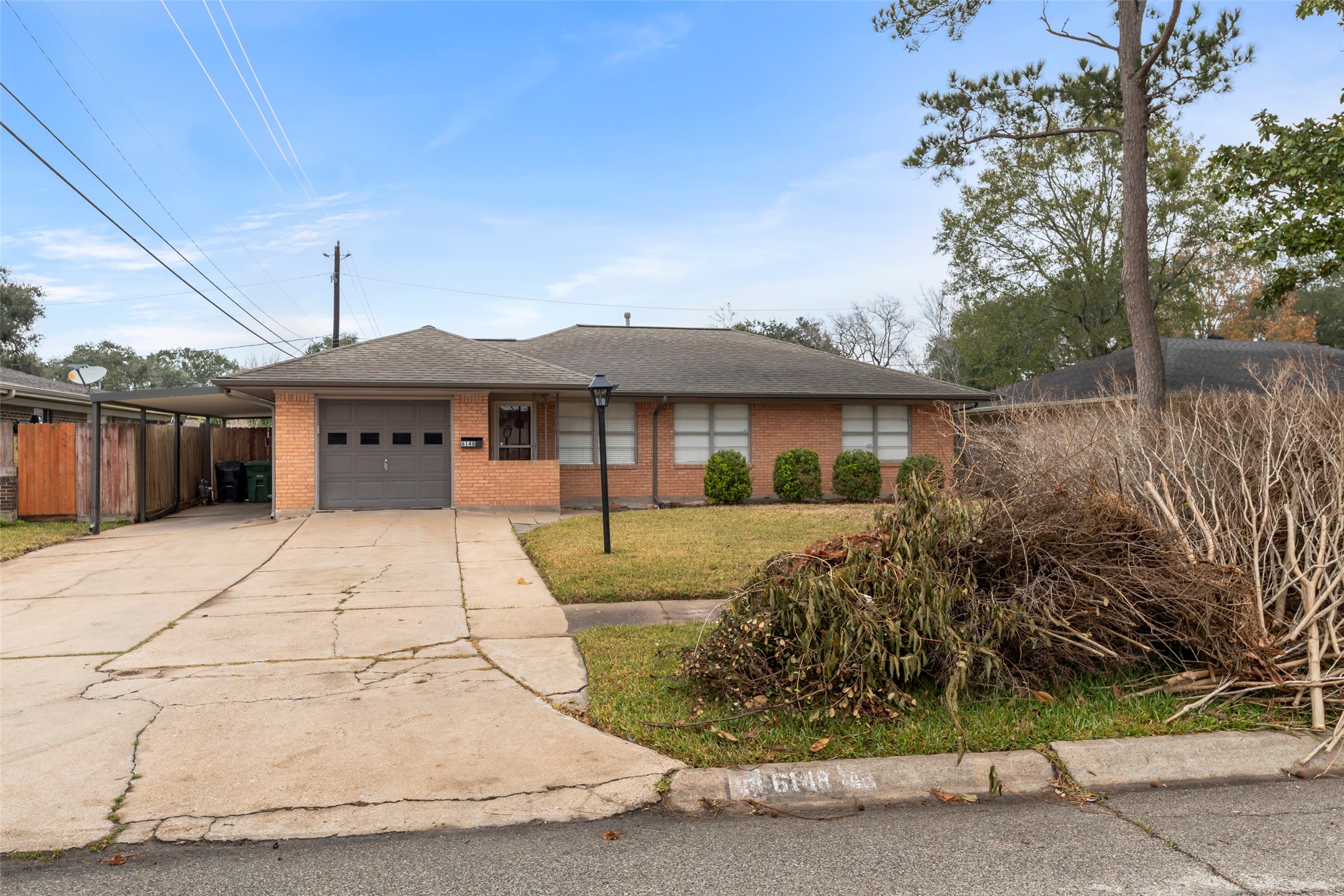 6148 Indigo Street Houston, TX 77074 - Photo 7 of 37 a front view of a house with a garden