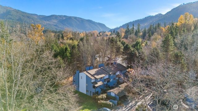 a view of a mountain with front of house
