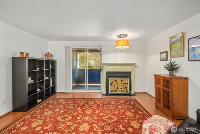 a bedroom with a bed and a fireplace