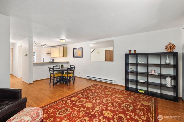 a view of a livingroom with furniture and window