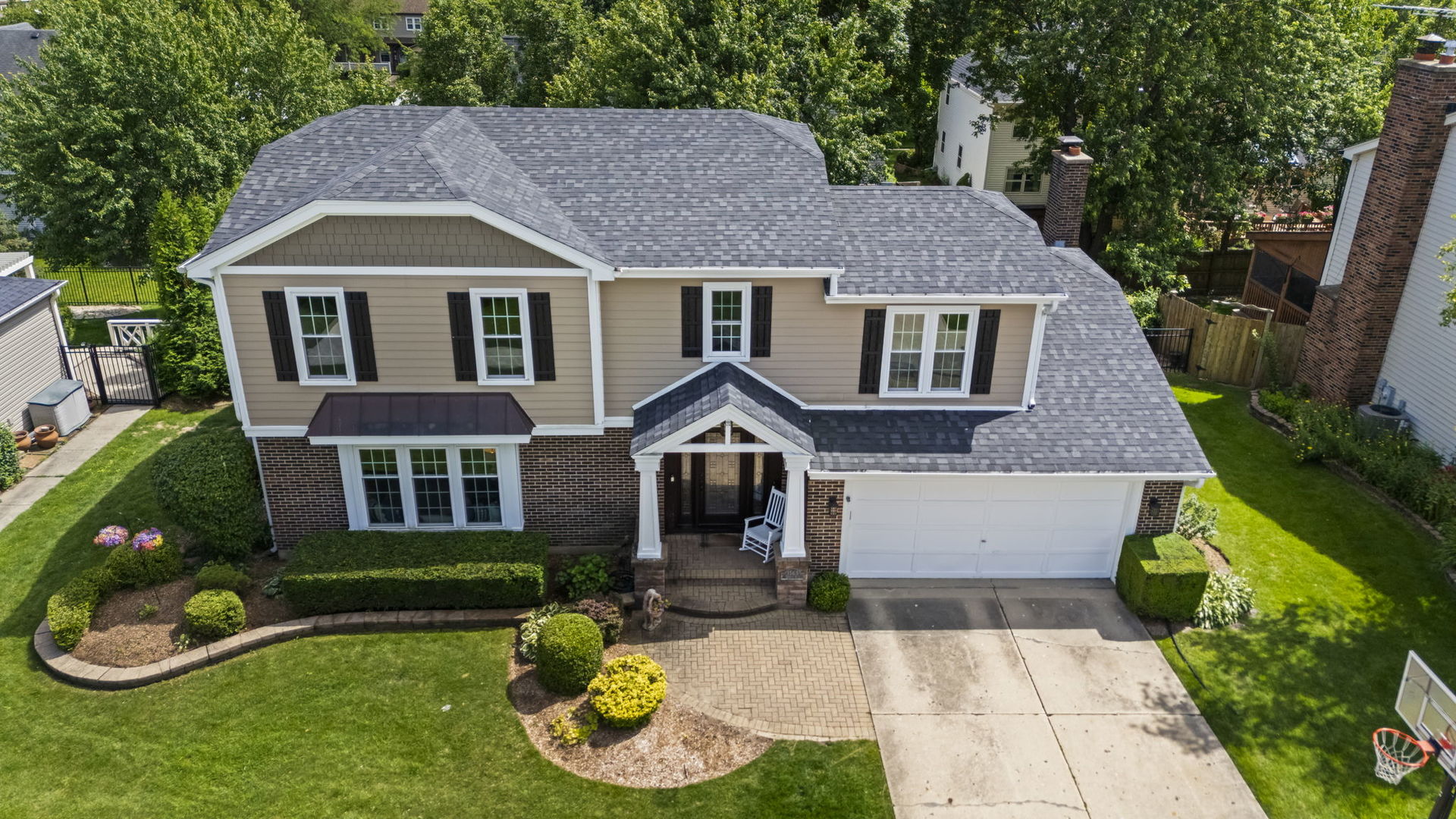 1565 Freeman Road Hoffman Estates, IL 60192 - Photo 46 of 46 a front view of a house with garden