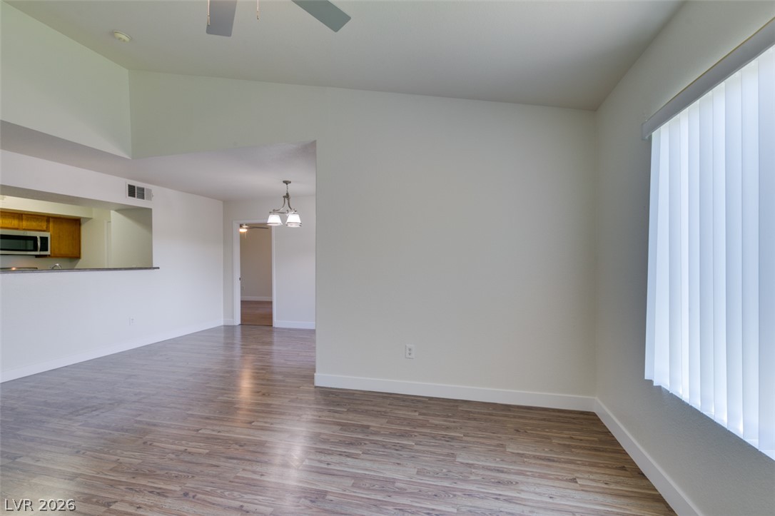 6650 West Warm Springs Road, Unit 2118 Las Vegas, NV 89118 - Photo 39 of 41 Discover an open floorplan with vaulted ceilings and beautiful wood-look flooring throughout.