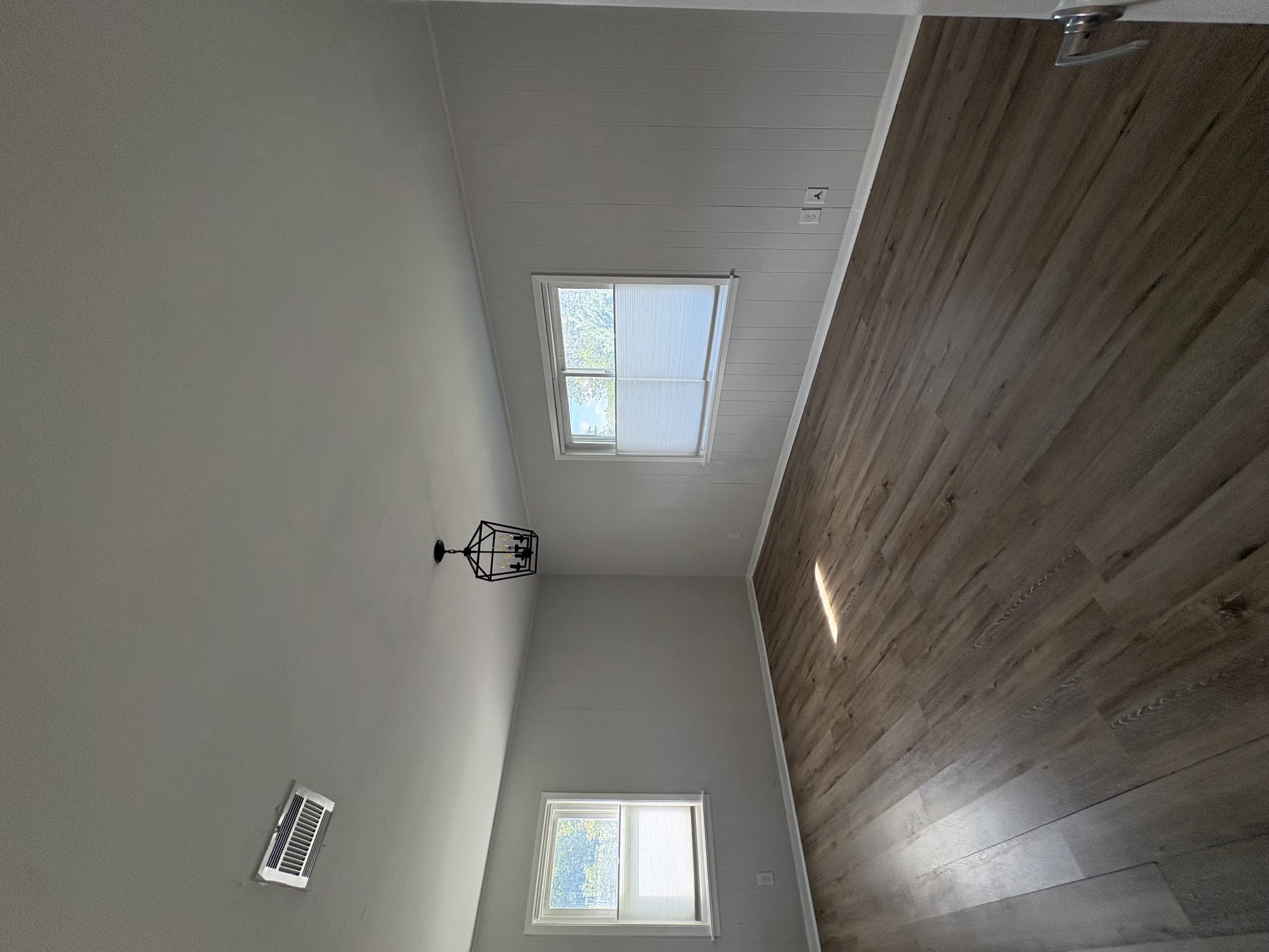 9032 Nuckols Crossing Road Austin, TX 78744 - Photo 10 of 14 Sun-filled interiors complement the rich, natural wood-look flooring.
