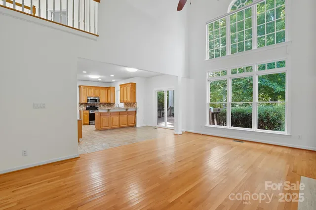 a kitchen with stainless steel appliances granite countertop a refrigerator oven a sink and dishwasher