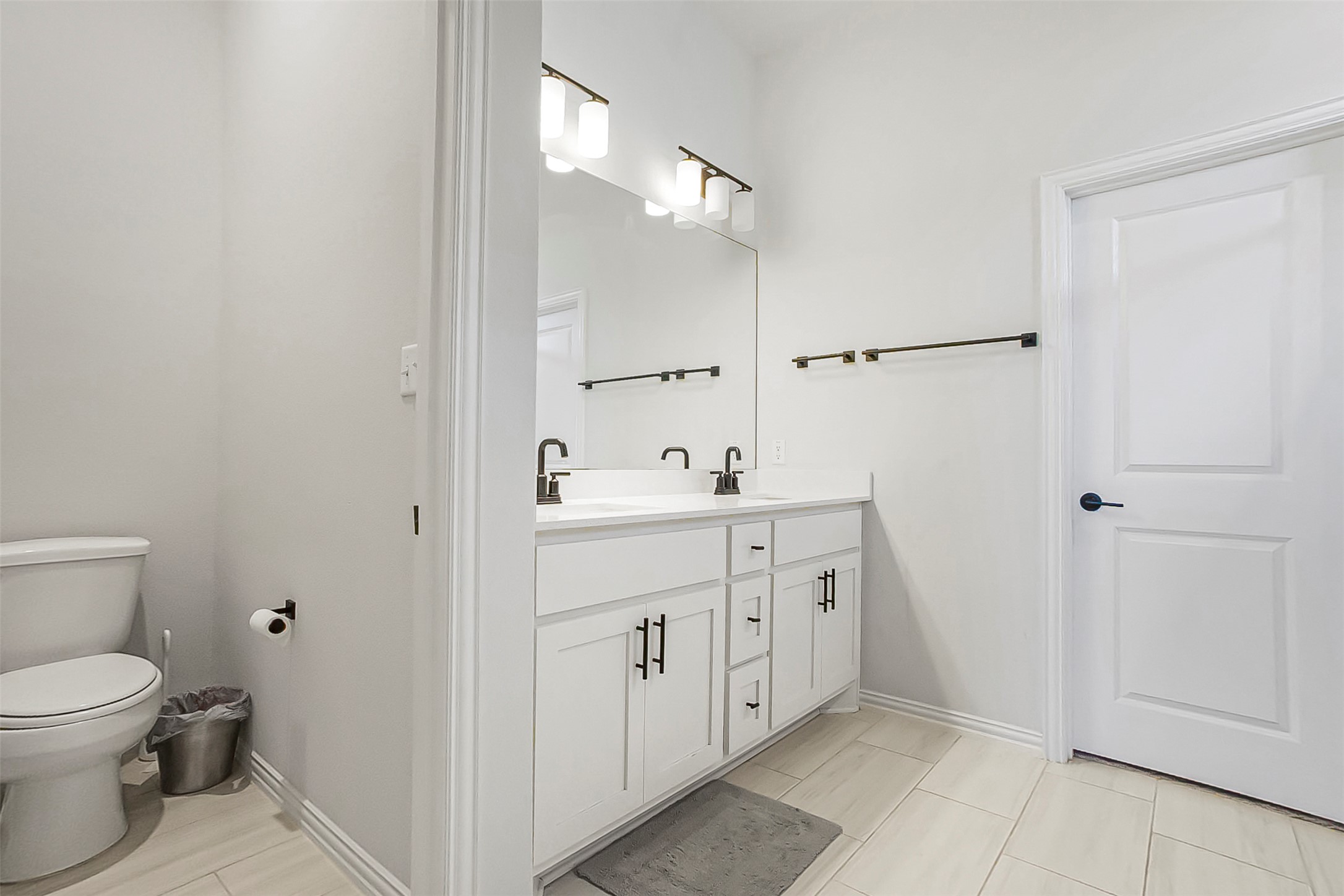 1016 Calendula Trail Georgetown, TX 78628 - Photo 16 of 40 Full bath featuring double vanity and light tile patterned floors