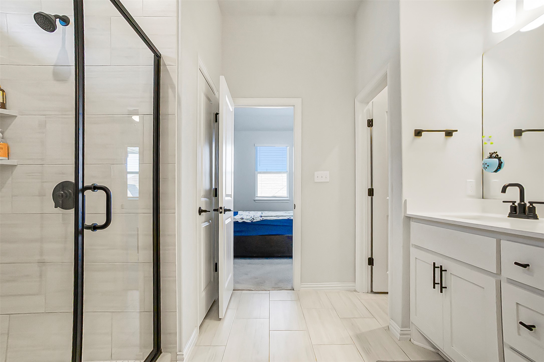 1016 Calendula Trail Georgetown, TX 78628 - Photo 19 of 40 Full bathroom with vanity, a shower stall, and connected bathroom