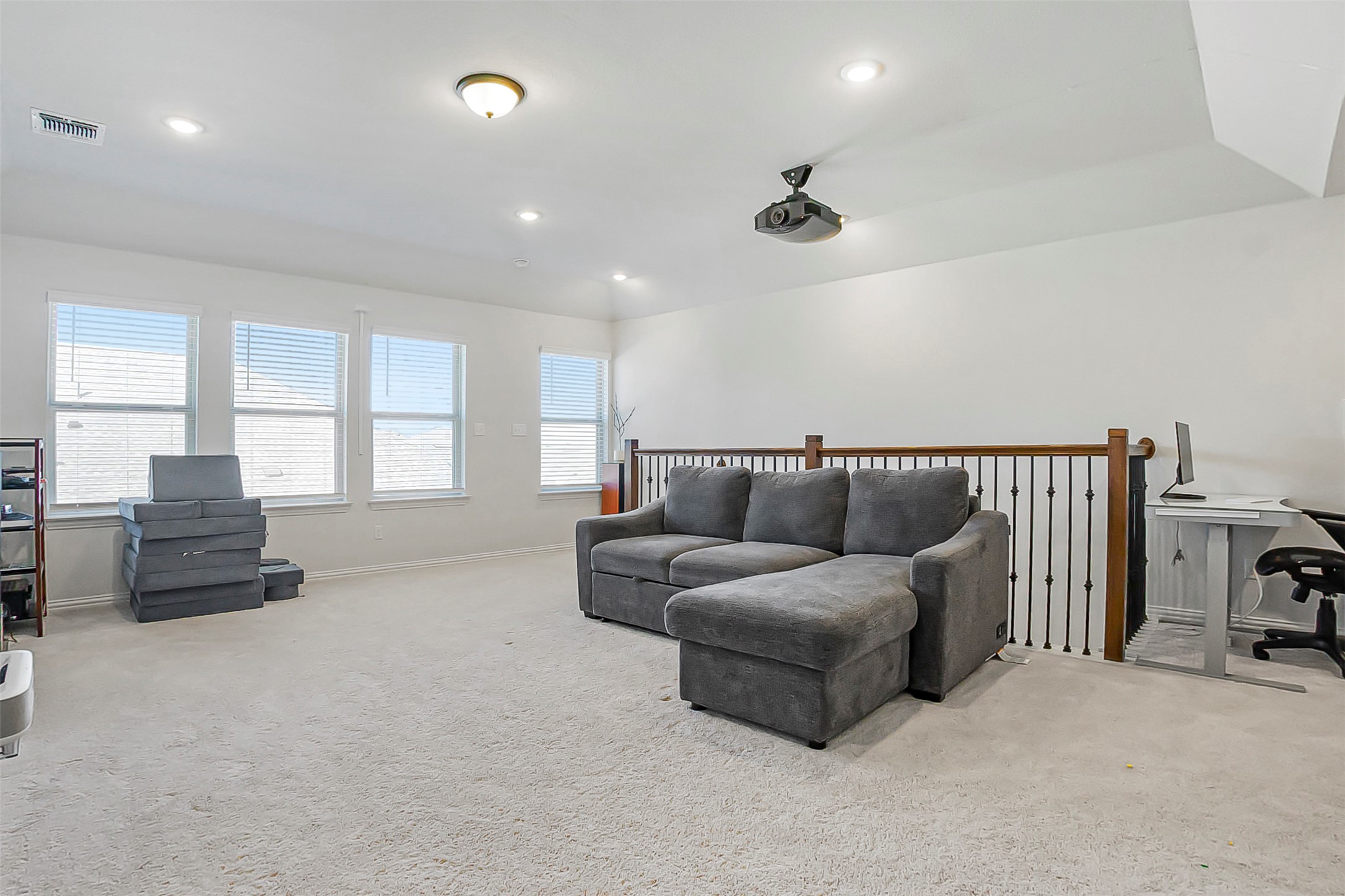1016 Calendula Trail Georgetown, TX 78628 - Photo 22 of 40 Living area featuring light carpet and recessed lighting