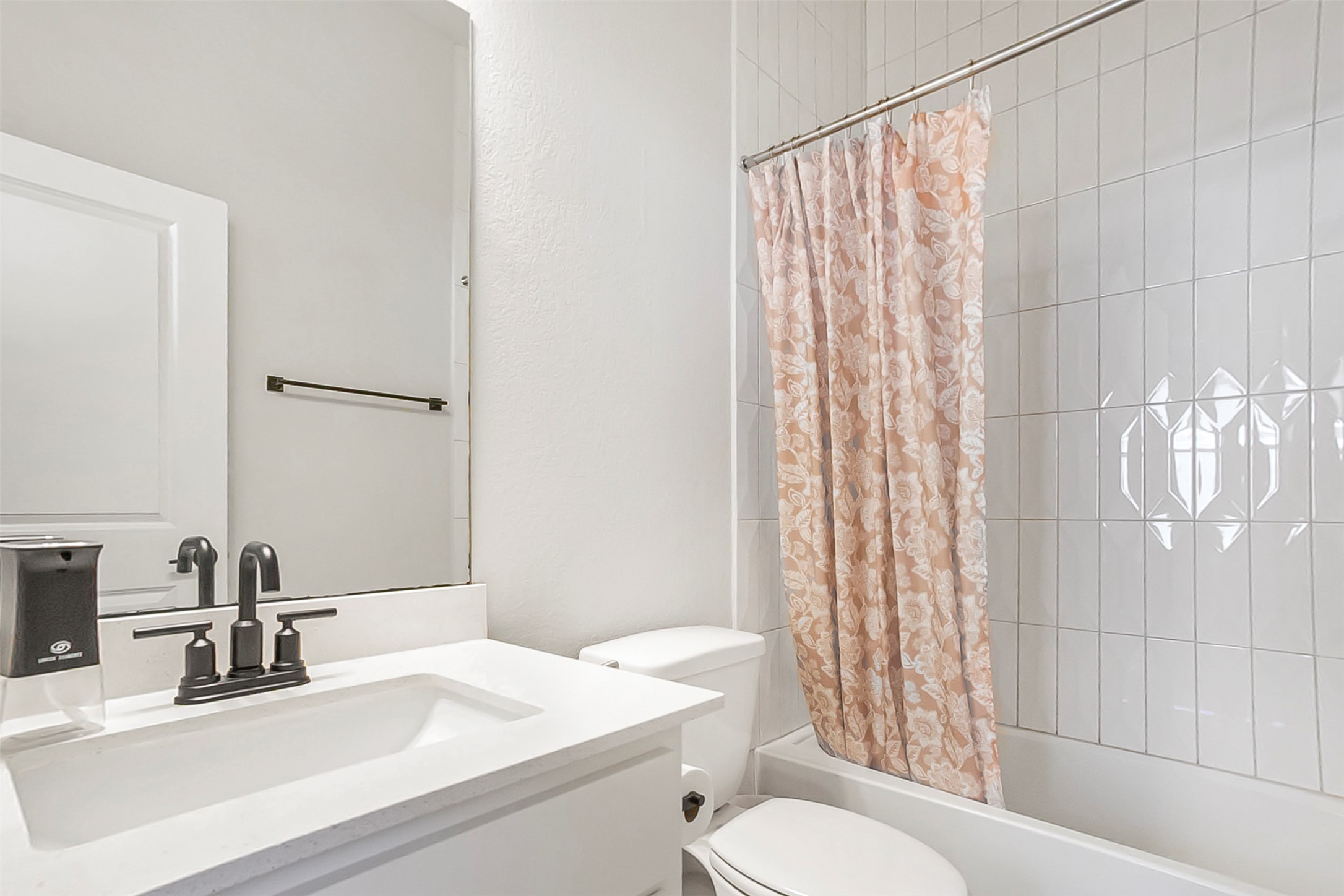 1016 Calendula Trail Georgetown, TX 78628 - Photo 27 of 40 Full bathroom featuring vanity and shower / bath combo with shower curtain